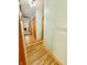 Hallway with hardwood floors and access to multiple rooms in the home at 6346 Shelby St, Indianapolis, IN 46227
