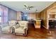 Spacious living room with hardwood floors, comfortable seating, and views of the kitchen area at 6346 Shelby St, Indianapolis, IN 46227