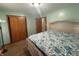 Large primary bedroom with hardwood floors, closet, and decorative headboard at 6346 Shelby St, Indianapolis, IN 46227