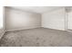 Spacious bedroom with neutral carpet, light walls, and ample natural light at 6413 Green Grass Ln, Whitestown, IN 46075