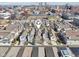 Beautiful aerial shot showcases the colorful townhomes against the city skyline at 645 Ellsworth St, Indianapolis, IN 46202
