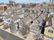Aerial view of colorful townhomes, each with unique architectural details including rooftop patios at 645 Ellsworth St, Indianapolis, IN 46202