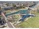 Bird's eye view of canal, playground, and walking paths on a bright day with blue skies at 645 Ellsworth St, Indianapolis, IN 46202
