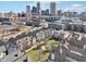Expansive aerial view showcases the community's green space set against the city skyline at 645 Ellsworth St, Indianapolis, IN 46202
