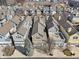 Aerial view of charming townhomes, each with unique architectural details and landscaping at 645 Ellsworth St, Indianapolis, IN 46202