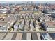 Beautiful aerial shot showcases the colorful townhomes against the city skyline at 645 Ellsworth St, Indianapolis, IN 46202
