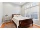 Bedroom with hardwood floors and large window at 645 Ellsworth St, Indianapolis, IN 46202
