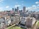 Beautiful shot of neighborhood homes and the city skyline on a sunny day with blue skies at 645 Ellsworth St, Indianapolis, IN 46202