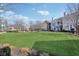 Expansive community lawn showcasing attractive residential buildings and mature trees at 645 Ellsworth St, Indianapolis, IN 46202
