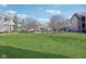 Well-maintained community lawn surrounded by charming residential buildings and lush landscaping at 645 Ellsworth St, Indianapolis, IN 46202