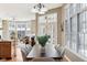 Dining area featuring hardwood floors and large windows with view to Gathering room at 645 Ellsworth St, Indianapolis, IN 46202