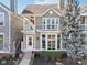 Charming two-story home featuring a private balcony, bay window, and beautifully landscaped front yard at 645 Ellsworth St, Indianapolis, IN 46202
