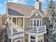 Close-up aerial view of a two-story home with a private balcony and manicured landscaping at 645 Ellsworth St, Indianapolis, IN 46202
