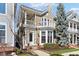 Charming two-story home with a balcony, bay windows, well-maintained lawn, and beautiful landscaping at 645 Ellsworth St, Indianapolis, IN 46202