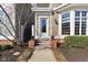 Traditional home exterior with brick accents, well-manicured landscaping, and a welcoming front entrance at 645 Ellsworth St, Indianapolis, IN 46202