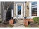Traditional home exterior with brick accents, well-manicured landscaping, and a welcoming front entrance at 645 Ellsworth St, Indianapolis, IN 46202