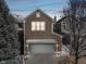 Detached two-car garage with a pergola and well-lit driveway, nestled in a peaceful neighborhood at 645 Ellsworth St, Indianapolis, IN 46202