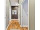 Hallway view with hardwood floors and white doors at 645 Ellsworth St, Indianapolis, IN 46202