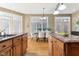 Gourmet kitchen flows into dining area with hardwood floors and modern cabinets at 645 Ellsworth St, Indianapolis, IN 46202