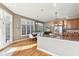 Open kitchen and dining area with hardwood floors and modern lighting at 645 Ellsworth St, Indianapolis, IN 46202