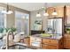 Kitchen and dining area featuring stainless steel appliances and access to the backyard at 645 Ellsworth St, Indianapolis, IN 46202