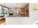 Bright kitchen with a granite countertop, stainless steel appliances, and a view to the dining area at 645 Ellsworth St, Indianapolis, IN 46202