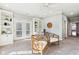 Living room with built-in shelving, french doors and modern lighting at 645 Ellsworth St, Indianapolis, IN 46202