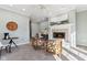 Living room featuring fireplace, modern seating, and home office space at 645 Ellsworth St, Indianapolis, IN 46202