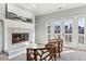 Bright living room features fireplace and access to outdoor balcony at 645 Ellsworth St, Indianapolis, IN 46202