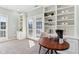 Bright living room featuring french doors, built-ins and a cafe feel at 645 Ellsworth St, Indianapolis, IN 46202
