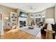 Bright and open living room with fireplace, built-in shelves, and large bay windows at 645 Ellsworth St, Indianapolis, IN 46202
