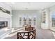 Light-filled living room with fireplace, built-in shelving, and patio doors at 645 Ellsworth St, Indianapolis, IN 46202