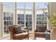 Bright living room with bay windows, hardwood floors, and stylish seating at 645 Ellsworth St, Indianapolis, IN 46202