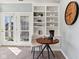 Living room with built-in shelving, a round table and a cafe vibe at 645 Ellsworth St, Indianapolis, IN 46202