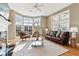 Elegant living room featuring a fireplace, large windows providing ample natural light, and stylish furnishings at 645 Ellsworth St, Indianapolis, IN 46202