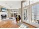 Sun-filled living room boasts fireplace, large windows, and elegant decor at 645 Ellsworth St, Indianapolis, IN 46202