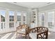 Cozy living room with french doors and stylish wood chairs at 645 Ellsworth St, Indianapolis, IN 46202
