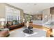 Well-lit living room featuring hardwood floors, comfortable seating, and seamless layout at 645 Ellsworth St, Indianapolis, IN 46202