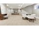 Large recreation room with table seating and a cozy entertainment area at 645 Ellsworth St, Indianapolis, IN 46202
