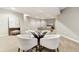 Open rec room features a glass table and chairs with views of the entertainment area at 645 Ellsworth St, Indianapolis, IN 46202