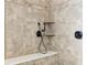 Modern shower featuring tile walls, a built-in bench, and stylish bronze fixtures at 645 Ellsworth St, Indianapolis, IN 46202