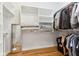 Walk-in closet with custom shelves and hanging rods, offering plenty of space for storage at 645 Ellsworth St, Indianapolis, IN 46202