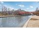Scenic waterfront view showcasing a peaceful canal, colorful bridge, and attractive landscaping at 645 Ellsworth St, Indianapolis, IN 46202