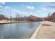 Charming waterfront scene with a picturesque bridge, serene canal, and inviting walkways at 645 Ellsworth St, Indianapolis, IN 46202