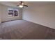 Bright bedroom with ceiling fan and neutral carpet at 6454 Waterstone Dr, Indianapolis, IN 46268