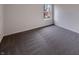 This bedroom has gray carpet and a window with natural light at 6454 Waterstone Dr, Indianapolis, IN 46268