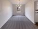 Bright dining room featuring chandelier and neutral carpet at 6454 Waterstone Dr, Indianapolis, IN 46268