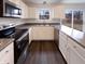 Modern kitchen with stainless steel appliances, white cabinets, and ample counter space at 6454 Waterstone Dr, Indianapolis, IN 46268