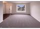 Inviting living room with hardwood floors and a large window at 6454 Waterstone Dr, Indianapolis, IN 46268