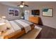 Spacious main bedroom featuring a ceiling fan, dresser, and serene decor at 6454 Waterstone Dr, Indianapolis, IN 46268